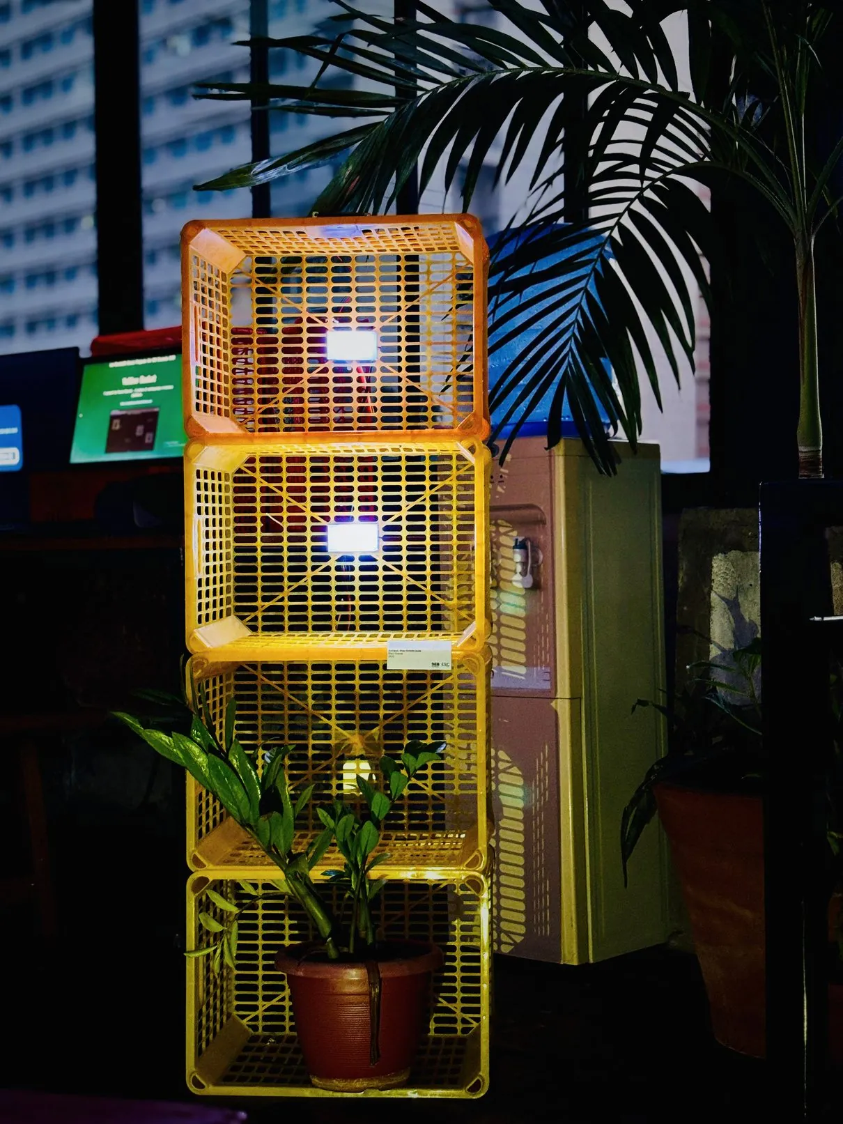 Close-up of the yellow crate tower with small white light modules
