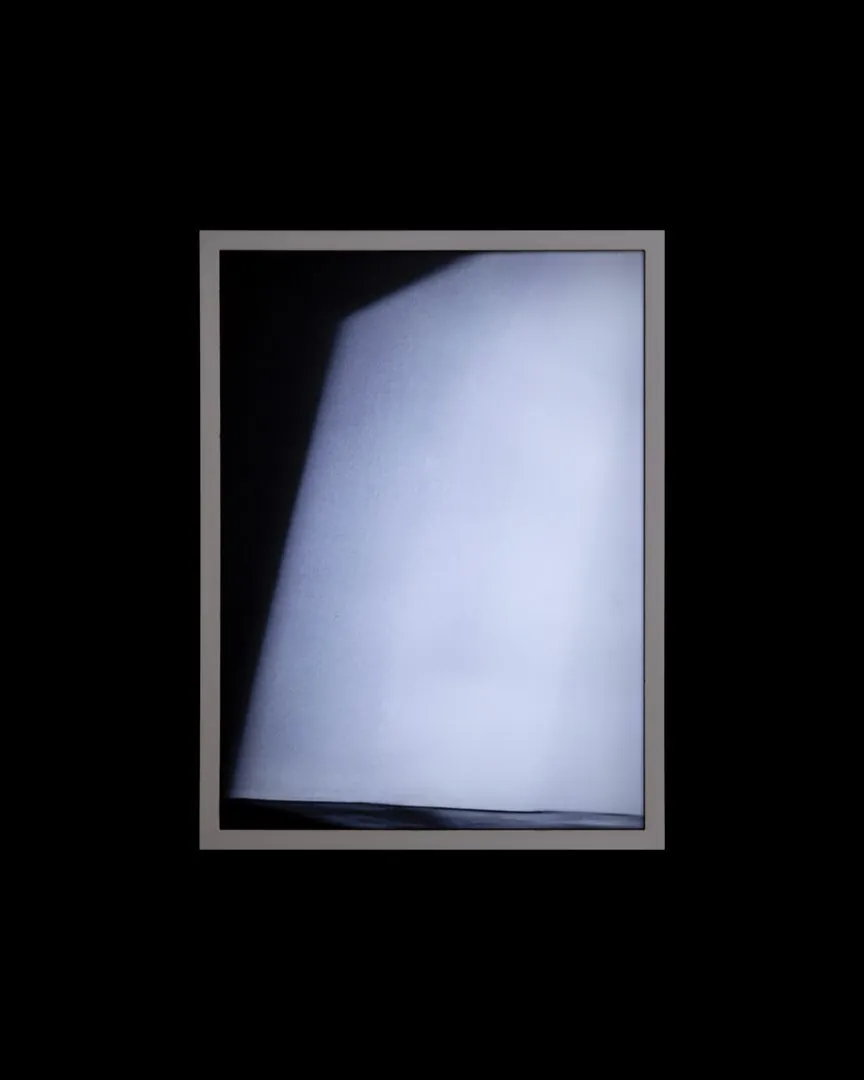 Light Residual I: a blurred backlit print in a frame