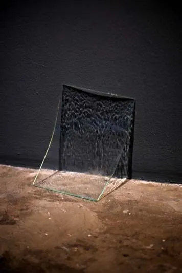 Withheld, detail: a textured resin form leaning against the wall