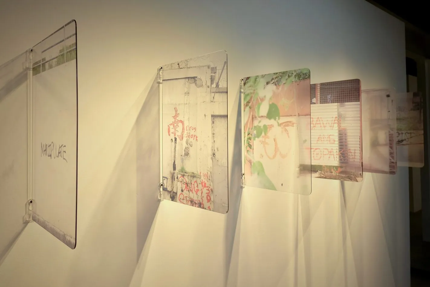 Close-up of the angled acrylic prints and their shadows